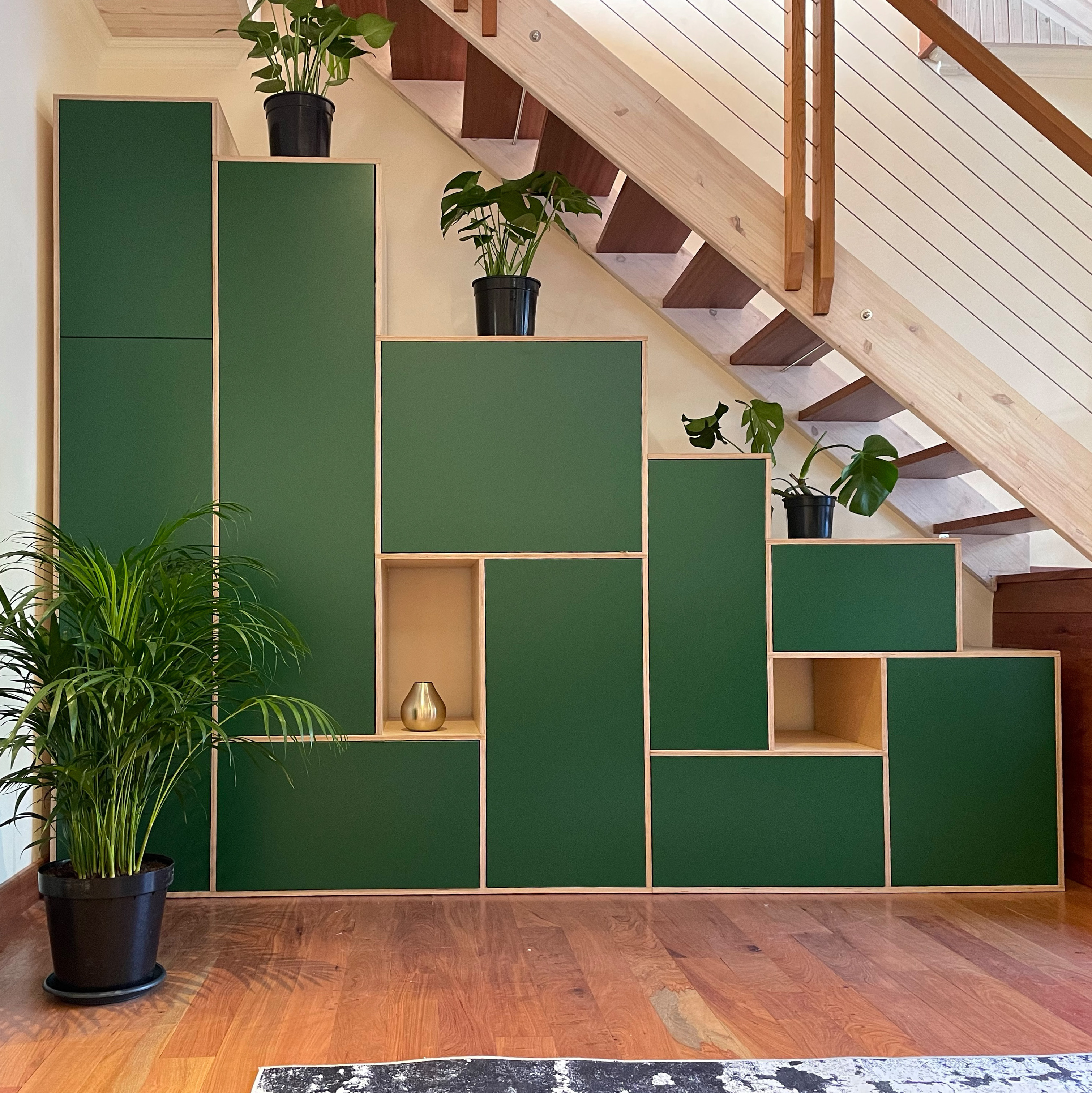 The reclaimed under-stair storage build, with vibrant colour accents.